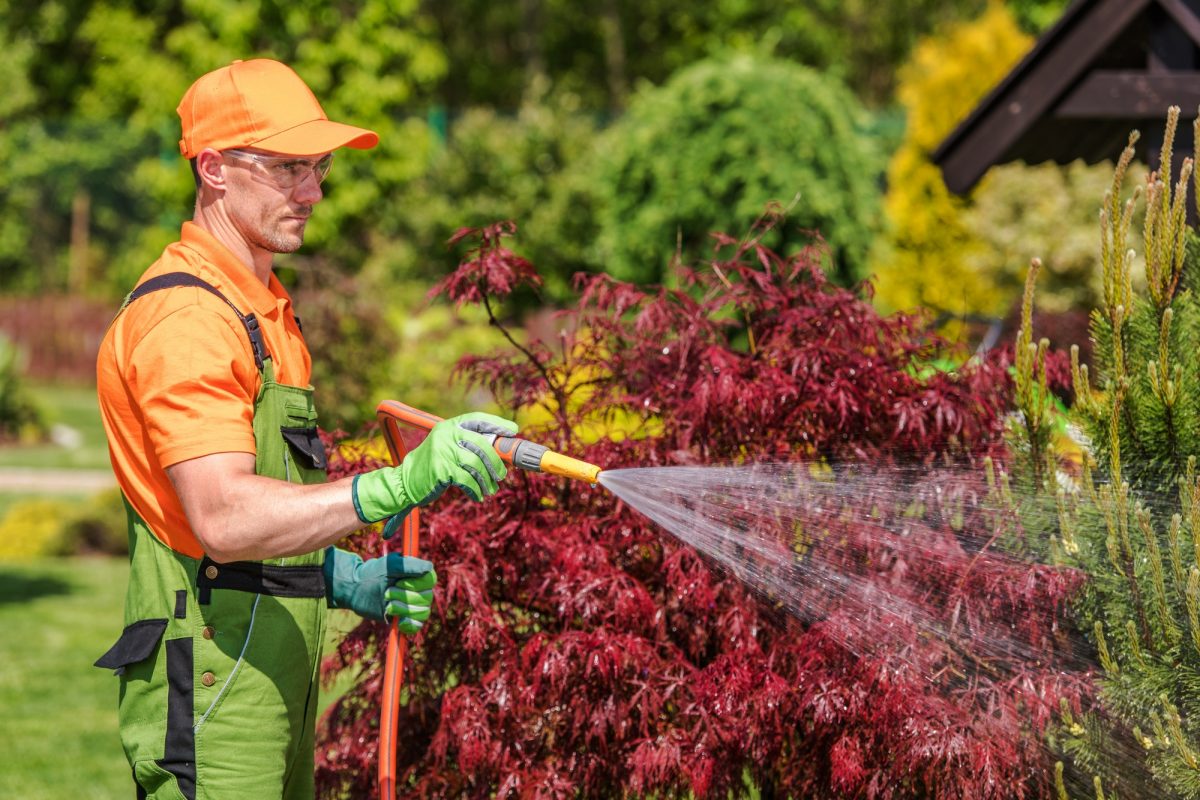 Gardener with Garden Hose